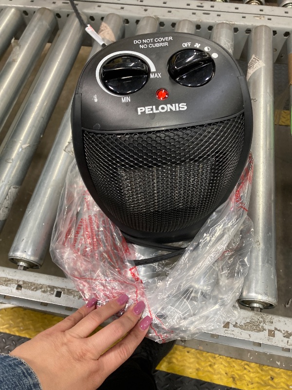 Photo 1 of *****TURNS ON AND OFF
PELONIS PHTA1ABB Portable, 1500W/900W, Quiet Cooling & Heating Mode Space Heater for All Season, Tip Over & Overheat Protection,for Home, Office Personal Use, Black , 9inch
