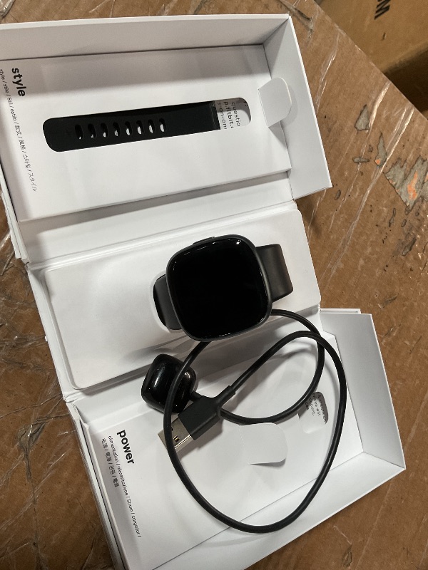 Photo 1 of ***(MAJOR DAMAGE/ SEE NOTES FOR DETAILS)***Fitbit Versa 4 Fitness Smartwatch with Daily Readiness, GPS, 24/7 Heart Rate, 40+ Exercise Modes, Sleep Tracking and more, Black/Graphite, One Size (S & L Bands Included)