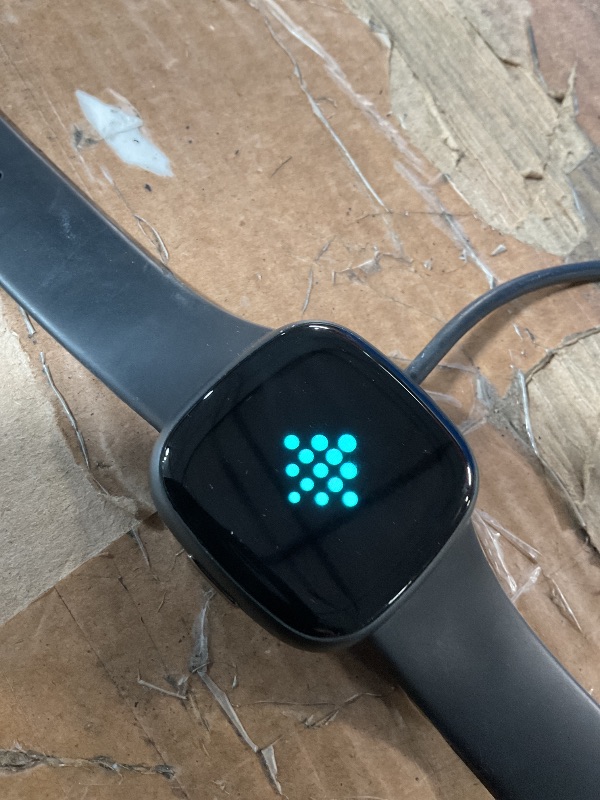 Photo 1 of ***(MAJOR DAMAGE/ SEE NOTES FOR DETAILS)***Fitbit Versa 4 Fitness Smartwatch with Daily Readiness, GPS, 24/7 Heart Rate, 40+ Exercise Modes, Sleep Tracking and more, Black/Graphite, One Size (S & L Bands Included)