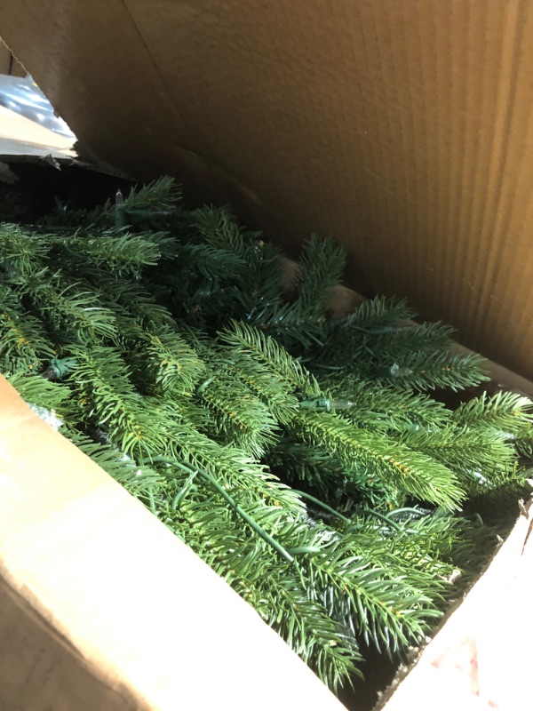 Photo 1 of ***DAMAGED LIGHTS DO NOT WORK*** National Tree Company 7.5 ft Pre-Lit Jersey Fraser Fir Artificial Christmas Tree, 1,250 Clear Lights, 3,144 Tips, Includes Stand, Green