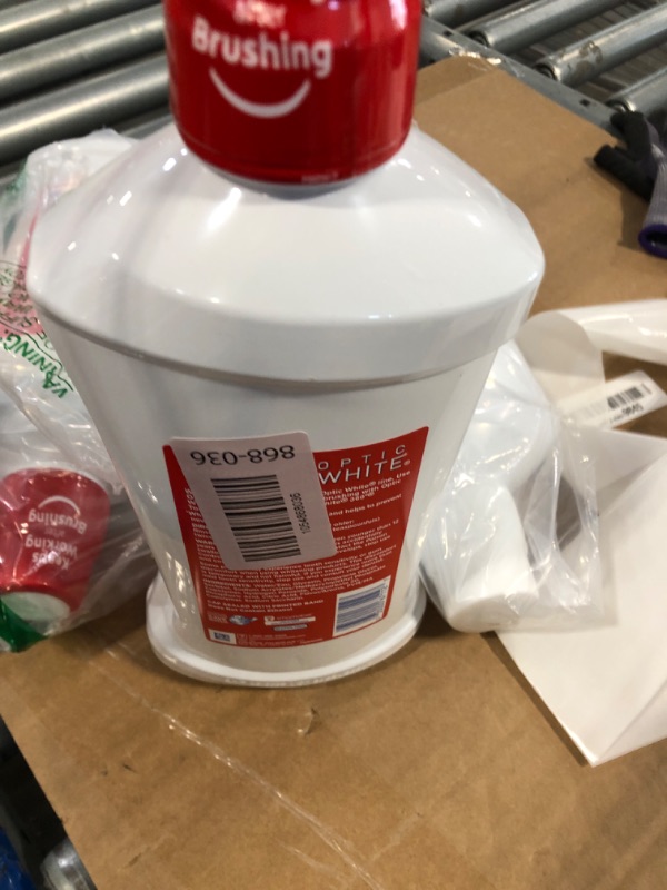 Photo 1 of ****FRABRIC SEALED****Colgate Optic White Mouthwash 32 Ounce (Value Pack of 4)
