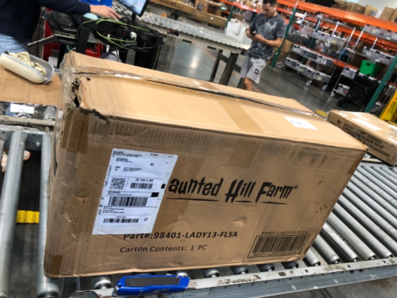 Photo 1 of **MISSING PARTS**MINOR DAMAGE**
Haunted Hill Farm Lifesize Animatronic Scary Haunted Woman with Touch Activated Lights and Sound, Battery-Operated Indoor or Covered Outdoor Halloween Decoration