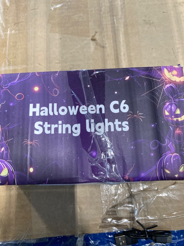Photo 1 of ** SOME BULBS DAMAGED** WATERGLIDE Halloween C6 String Lights, 33ft 100 LED Black Wire Fairy Lights with 29V Safe Adaptor, 8 Lighting Mode, Waterproof for Indoor Outdoor Patio Xmas Tree Party Decor, Orange & Purple