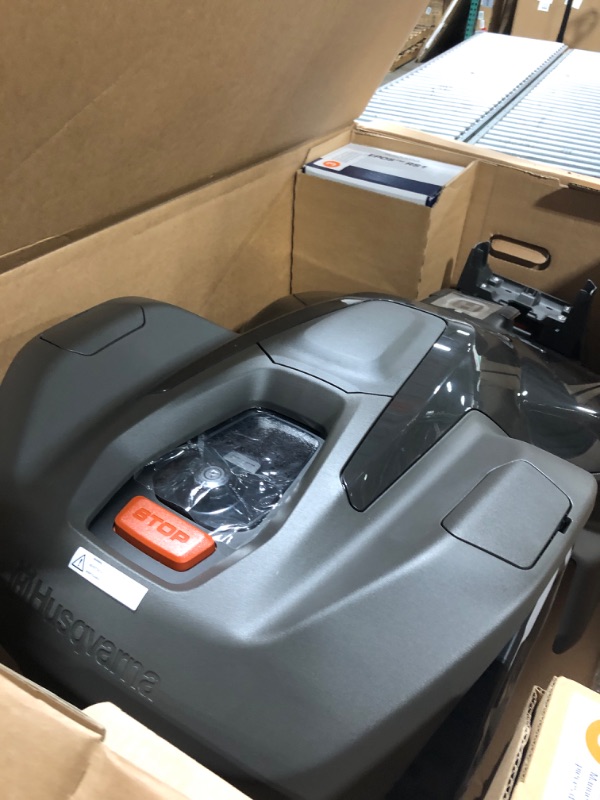 Photo 1 of ** BRAND NEW ITEM / UNTESTED ** Husqvarna 410iQ Automower Robotic Mower, 0.5 Acre Mowing Capacity, Wire Free Robot Lawn Mower with Charging Station, RS1 EPOS Reference Station and Replacement Blades, 970727401