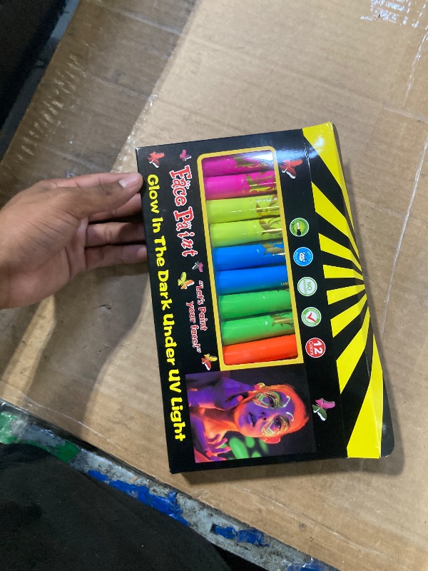 Photo 1 of 12 Pieces Glow Blacklight Face & Body Paint Makeup, Glow in The Dark Face Painting Kit Neon Paint Sticks for Kids Adult Halloween Glow Party