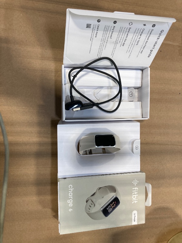 Photo 1 of **** S/N 4275442F4101 **** Fitbit Charge 6 Fitness Tracker with Google apps, Heart Rate on Exercise Equipment, 6-Months Premium Membership Included, GPS, Health Tools and More, Porcelain/Silver, One Size (S & L Bands Included)