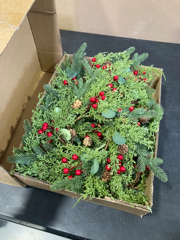 Photo 1 of Aneco 8 Pieces Christmas Candle Rings Wreath with Ribbon 8.7 Inch Wreath Holder Pillar Candlestick Norfolk Pine Garland Artificial Red Berries Branch Pinecones Wreaths for Xmas Table Centerpiece