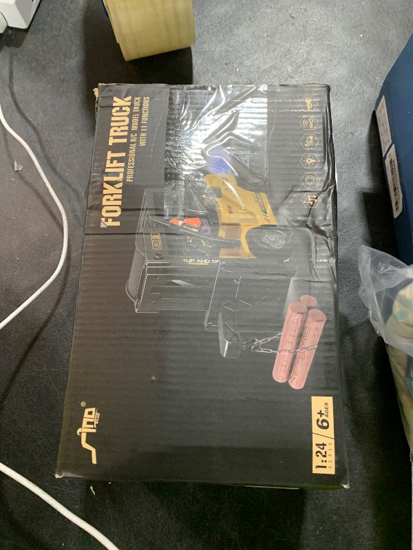 Photo 1 of **INCOMPLETE** QuirkyGlee Remote Control Forklift 12 Channel 2 Mode RC Forklift, W/Pallets/Boxes/Sound/Light/Spray, Two Rechargeable Batteries & Charge, Kids Forkliftrrucks Toy Christmas & Birthday Gifts