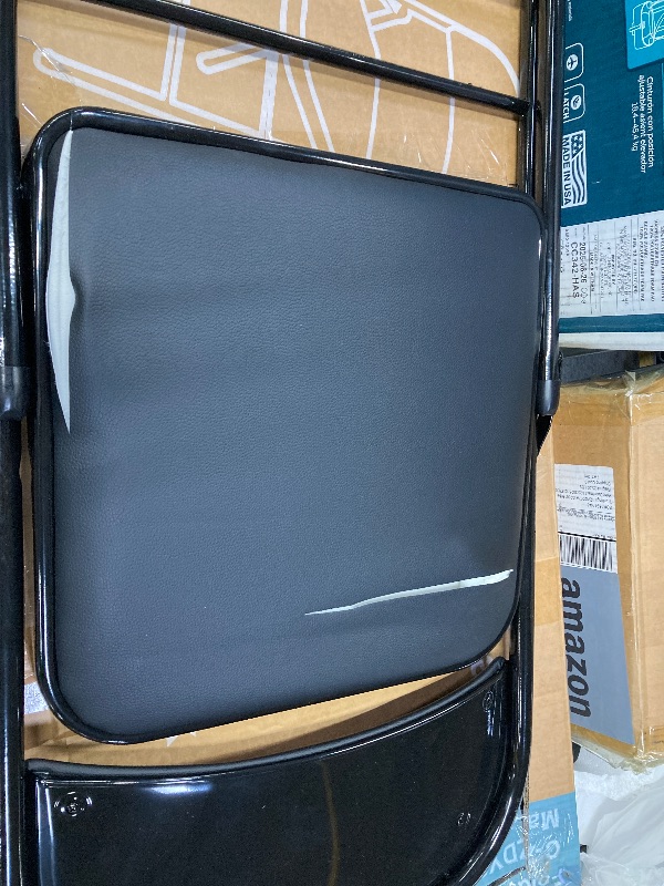 Photo 1 of **ONE CHAIR IS DAMAGE FROM BOX CUTTER-SEE PIC**CONCETTA 2 Pack Sturdy Metal Folding Chair with 350-Pound Capacity, Metal Frame, Water-Resistant, Ideal for Indoor and Outdoor Events, Black