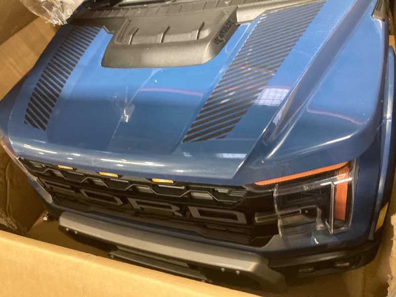 Photo 1 of 24V Ride on Cars 2 Seater for Kids, Ford F150 Raptor Battery Powered Ride on Toys Truck with Remote Control, 4 Wheels Spring Suspension, Electric Car for Kids Toddler 3-8 w/Bluetooth & Lights, Blue