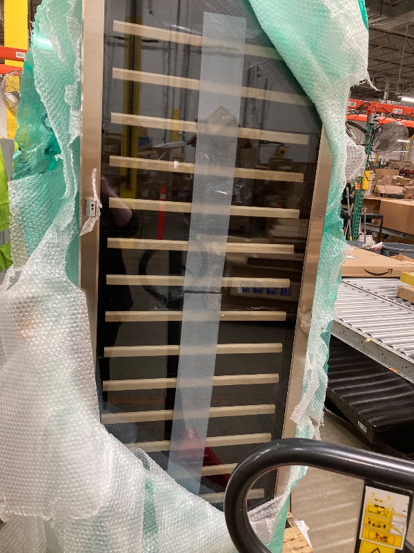 Photo 1 of *Unsure if it works properly* *Dent on the door, Light didn't work, no noise, Doorhandle broken*  Wine Cooler