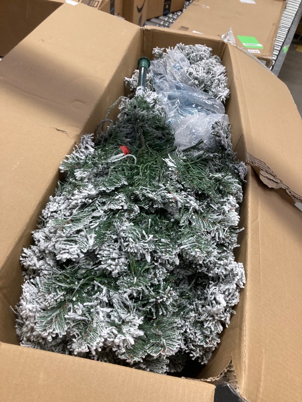 Photo 1 of Alupssuc 7.5ft Prelit Snow Flocked Artificial Pencil Christmas Tree with Warm White Lights, Full Branch Tips, Perfect Choice Decoration for Xmas Holiday