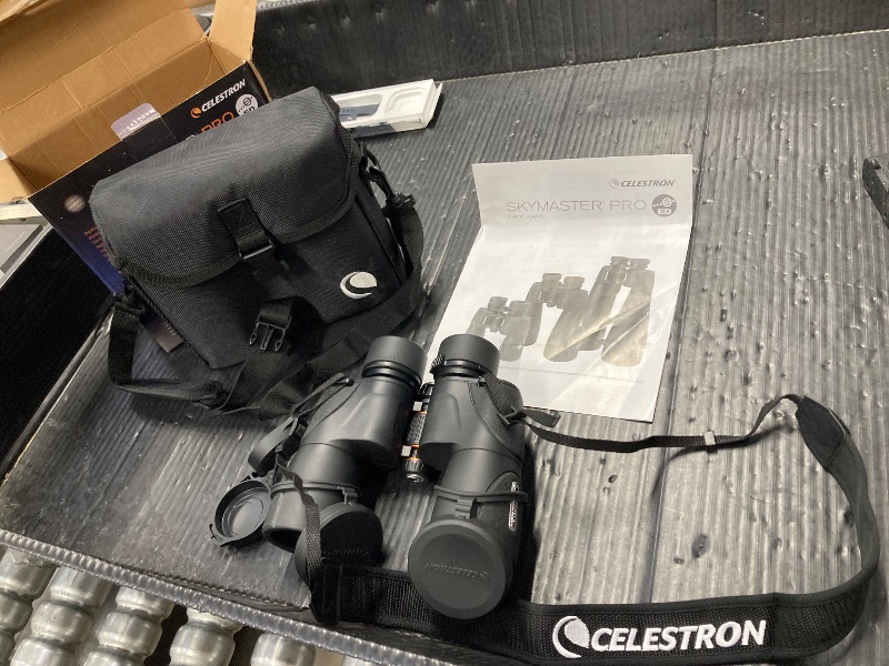 View 2 of ***EYE COVER HAS A SMALL TEAR* REFER TO PICTURE***Celestron – SkyMaster Pro ED 7x50 Binocular – Astronomy Binocular with ED Glass – Large Aperture for Long Distance Viewing – Fully Multi-Coated XLT Coating – Tripod Adapter and Carrying Case Included***EYE