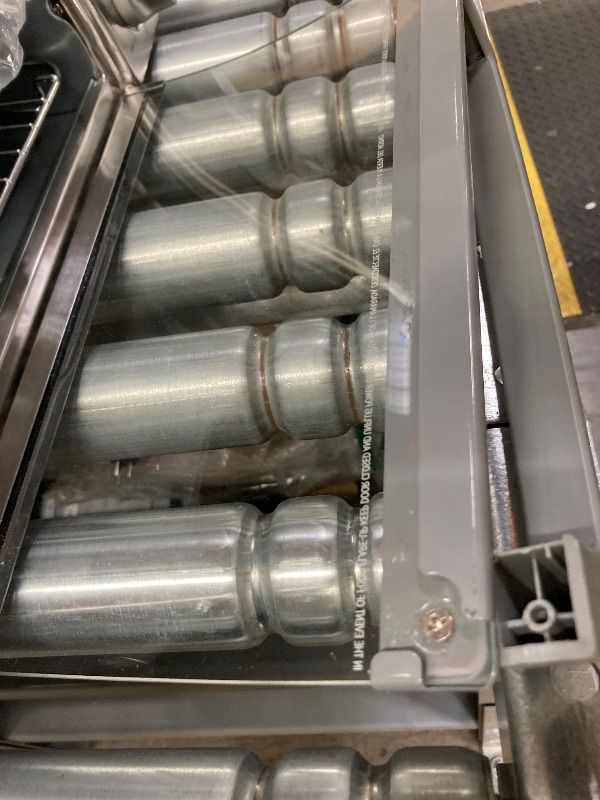 Photo 1 of **HAS DENTS AND DOOR HANDLE IS BROKEN**BLACK+DECKER 4-Slice Toaster Oven with Natural Convection, Stainless Steel, TO1760SS (TO1760SST-1)