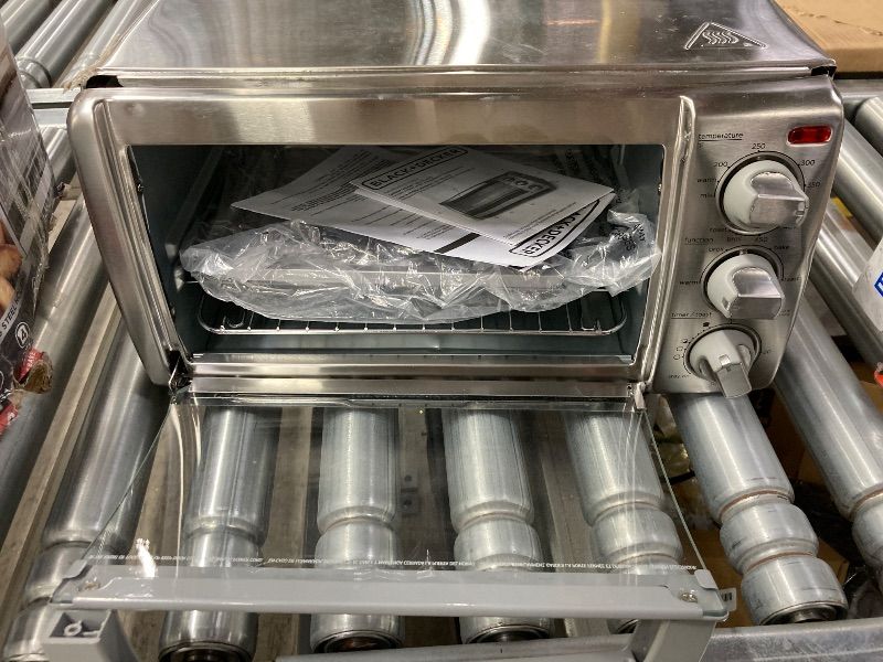 Photo 1 of **HAS DENTS AND DOOR HANDLE IS BROKEN**BLACK+DECKER 4-Slice Toaster Oven with Natural Convection, Stainless Steel, TO1760SS (TO1760SST-1)