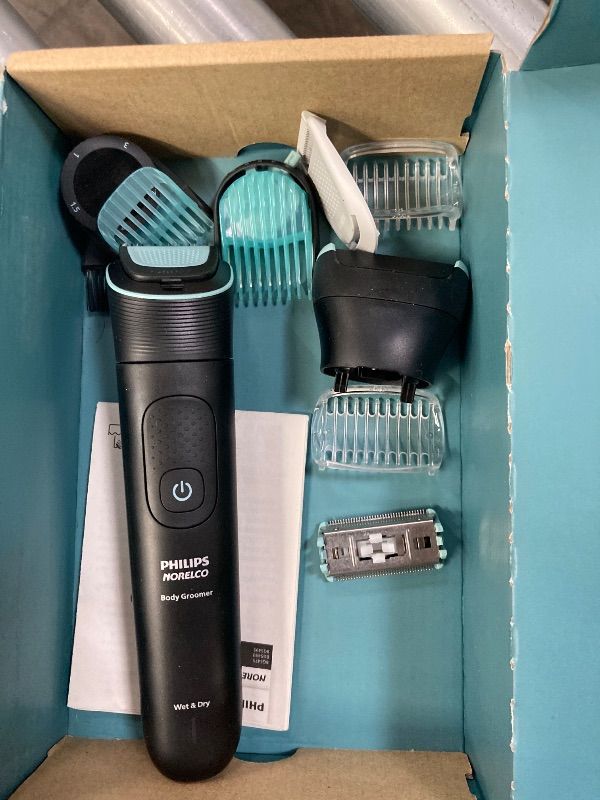Photo 1 of **MISSING CHARGER PLUG***Philips Norelco Body Groomer 5000 Series, Intimate Hair Trimmer & Shaver for Men with Dual 100% Showerproof Full Body Shave & Trim Heads and Two Bi-Di