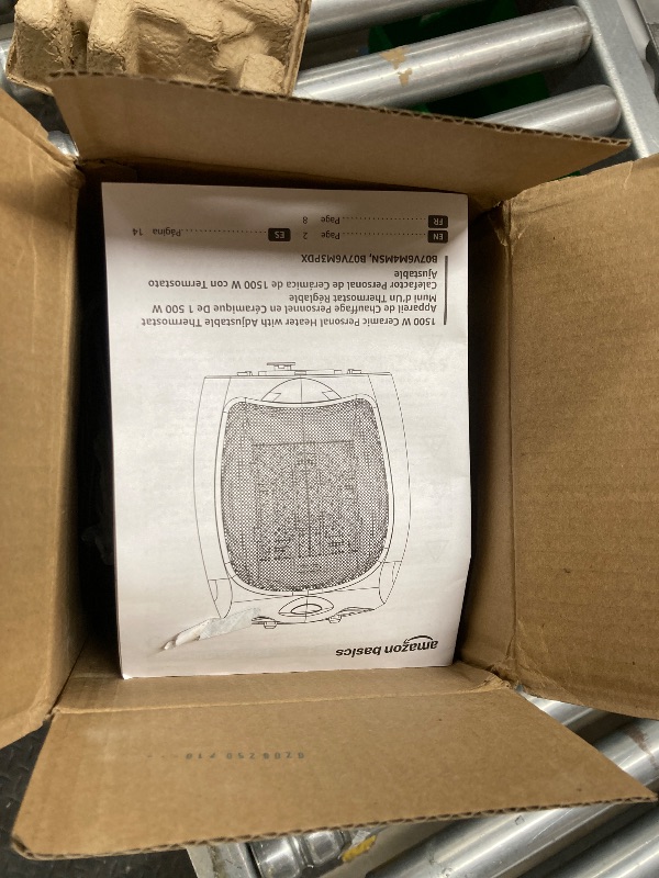 Photo 1 of Amazon Basics Ceramic Space Heater, Portable Indoor Heating Solution, With Overheat and Tip-Over Protection, Thermostat, Non-Oscillating, 1500W, 7.52"D x 6.34"W x 9.45"H, Silver