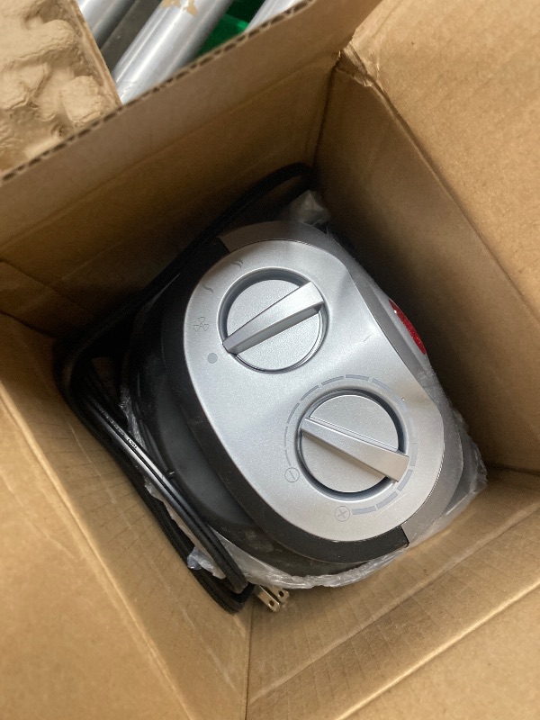 Photo 1 of Amazon Basics Ceramic Space Heater, Portable Indoor Heating Solution, With Overheat and Tip-Over Protection, Thermostat, Non-Oscillating, 1500W, 7.52"D x 6.34"W x 9.45"H, Silver