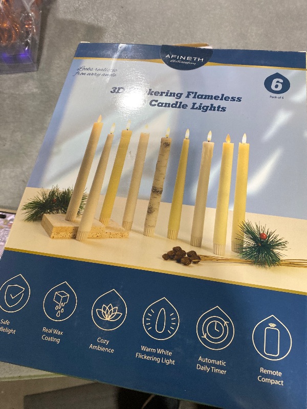 Photo 1 of Flameless Taper Candles with 3D Wick, 9.6" Real Wax LED Candles with 2 Remote and Timer, 6 Pack Flickering Candlesticks Battery Operated, Classic Tall Taper Candle for Home, Wedding, Party, Ivory