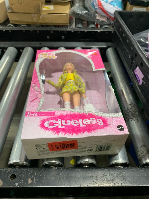 Photo 1 of Barbie Signature Doll, Clueless Cher Collectible in Yellow Plaid Suit with Backpack, Cell Phone, & Learner’s Permit Accessories