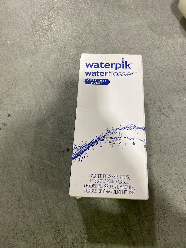 Photo 1 of Waterpik Cordless Pulse Rechargeable Portable Water Flosser for Teeth, Gums, Braces Care and Travel with 2 Flossing Tips, Waterproof, ADA Accepted, WF-20 White, Packaging May Vary
