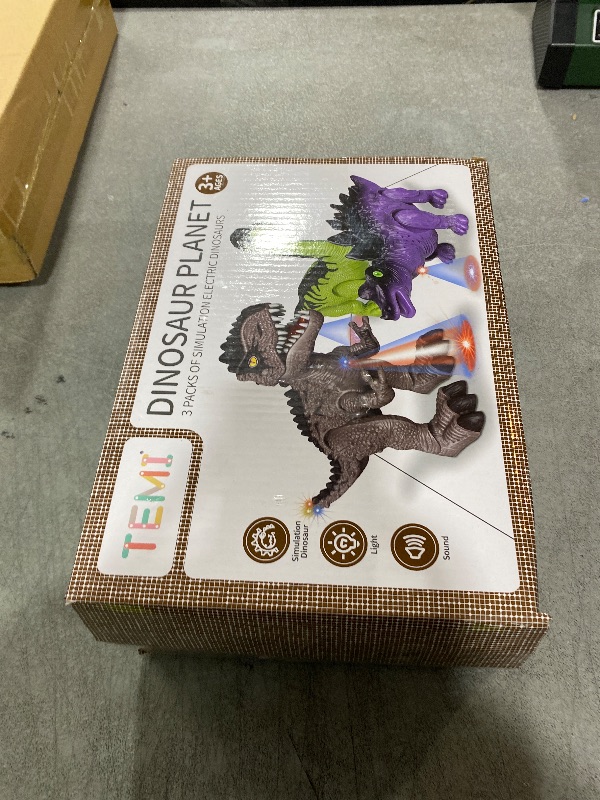 Photo 1 of TEMI 3 Pack Electrical Walking Dinosaur Toys for Toddlers 3-4 3-5 Years with Sound and Light Up, Toddler Robot Dinosaur, Brachiosaurus, Stegosaurus Dinosaur Figures for Kids
