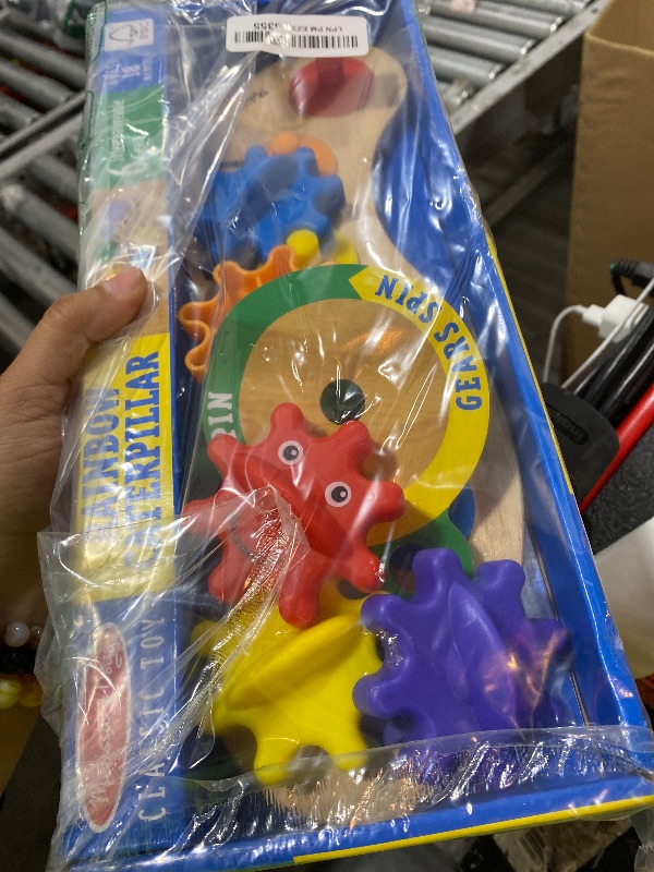 Photo 1 of Melissa & Doug Rainbow Caterpillar Gear Toy with 6 Interchangeable Gears