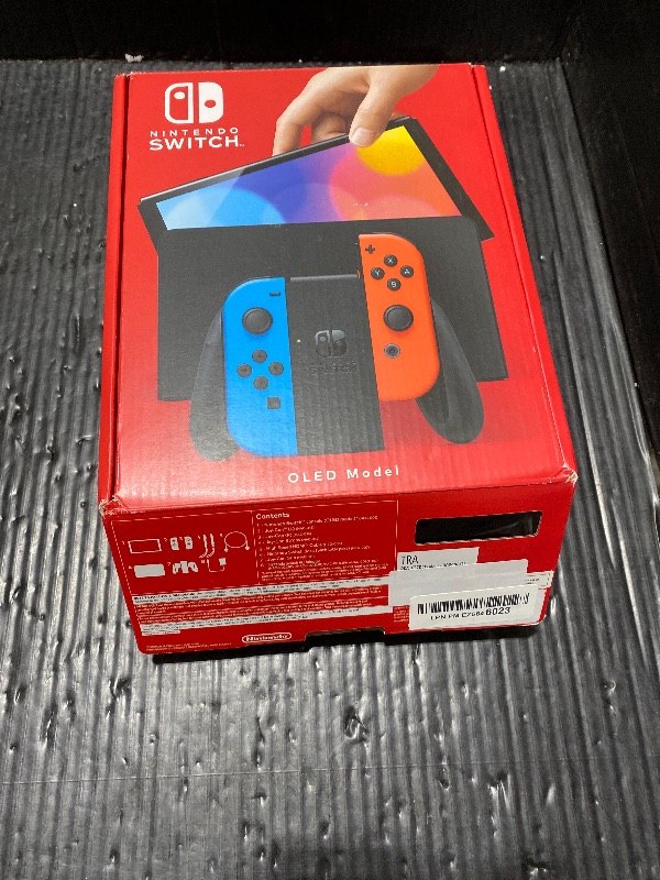 Photo 1 of Nintendo Switch – OLED Model w/Neon Red & Neon Blue Joy-Con