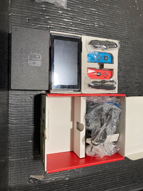 Photo 1 of Nintendo Switch – OLED Model w/Neon Red & Neon Blue Joy-Con