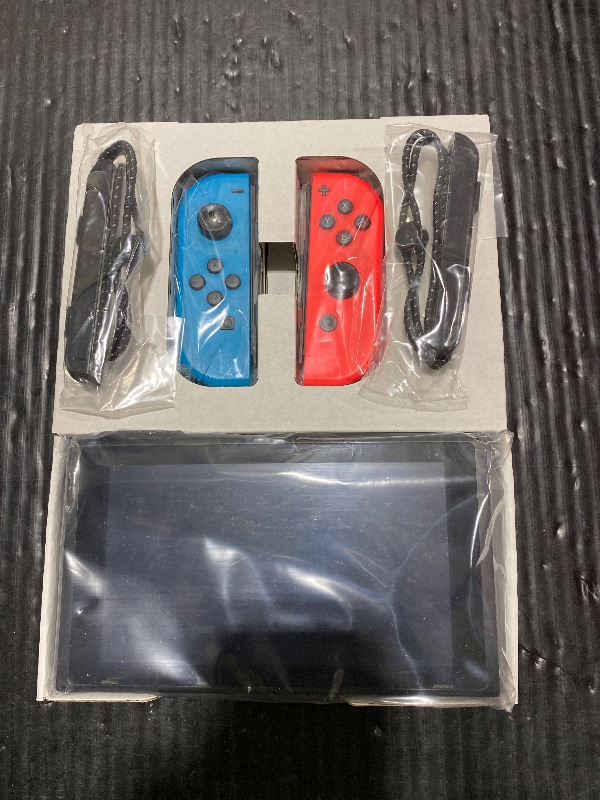Photo 1 of Nintendo Switch – OLED Model w/Neon Red & Neon Blue Joy-Con