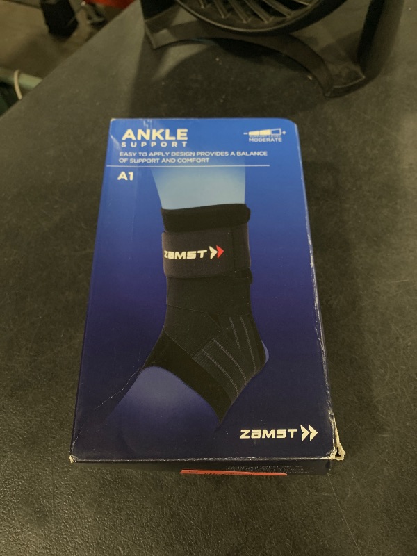 Photo 1 of Zamst A1 Black Ankle Brace for Sports - Breathable Sports Ankle Support for Men and Women with Adjustable Three Way Straps for Moderate Lateral Ankle Sprain - Left, Small