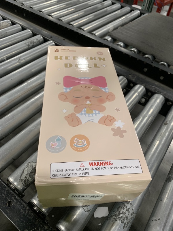 Photo 1 of ROBUD 17-Inch Reborn Baby Doll – Lifelike Infant with Silicone Vinyl Skin, Includes Bottle, Nappy, Pacifier, and Birth Certificate, for Kids 3+