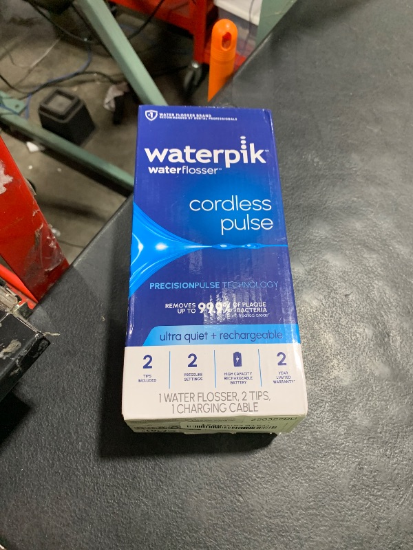 Photo 1 of Waterpik Cordless Pulse Rechargeable Portable Water Flosser for Teeth, Gums, Braces Care and Travel with 2 Flossing Tips, Waterproof, ADA Accepted, WF-20 White, Packaging May Vary