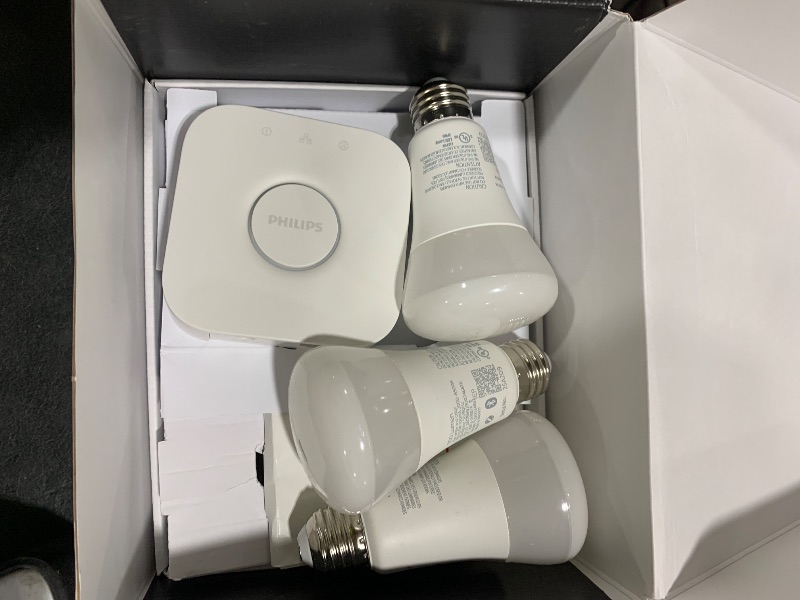 Photo 1 of Philips Hue Smart Light Starter Kit - Includes (1) Bridge and (4) 75W A19 E26 LED Smart White and Color Ambiance Bulbs - Control with App - Compatible with Alexa, Google Assistant, and Apple HomeKit