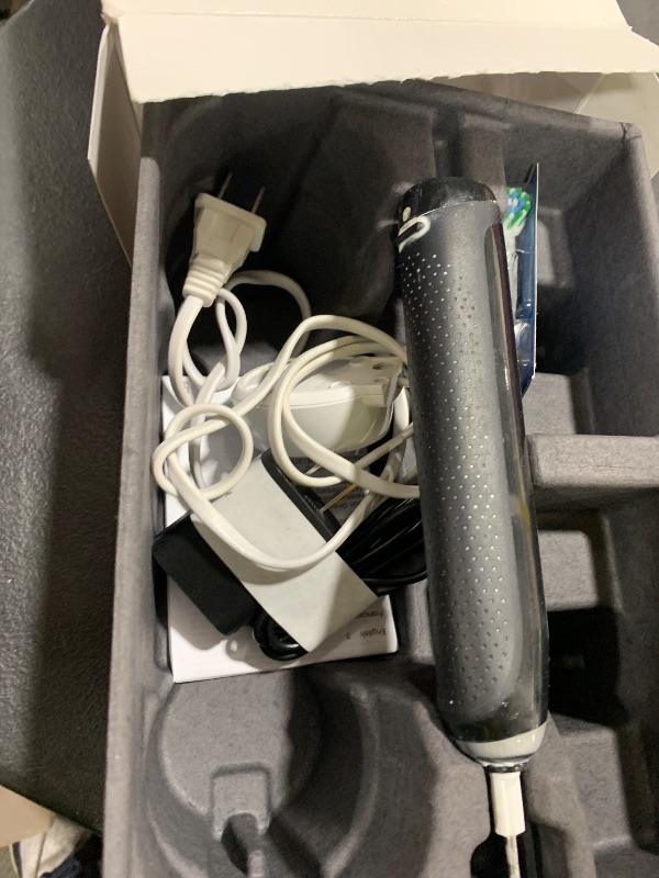 Photo 1 of Oral-B iO Deep Clean + Protect Rechargeable Electric Toothbrush, Black with a iO Series 7 Toothbrush, 2 Replacement Brush Heads, and a Charging Travel Case