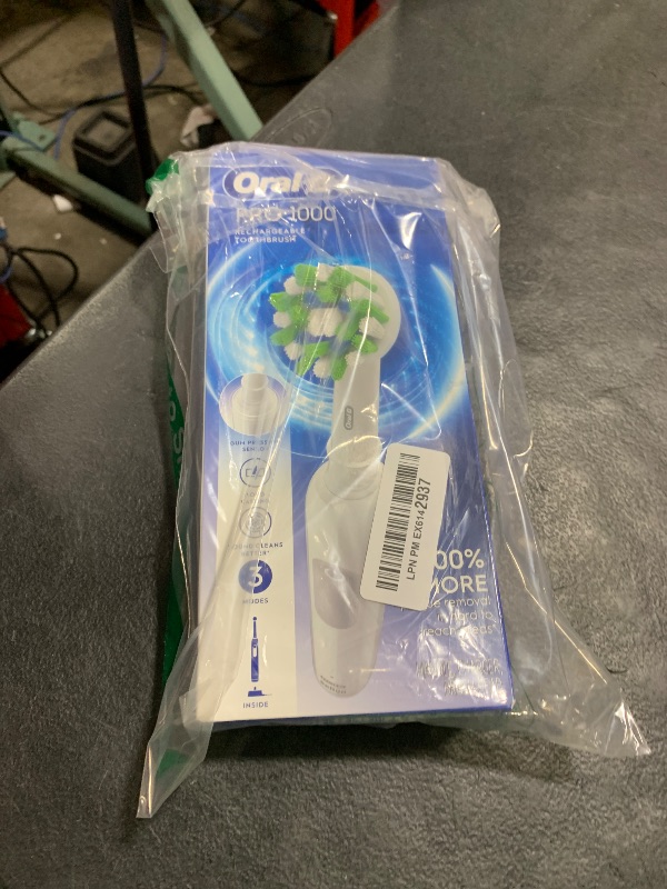 Photo 1 of Oral-B Pro 1000 Rechargeable Electric Toothbrush, White