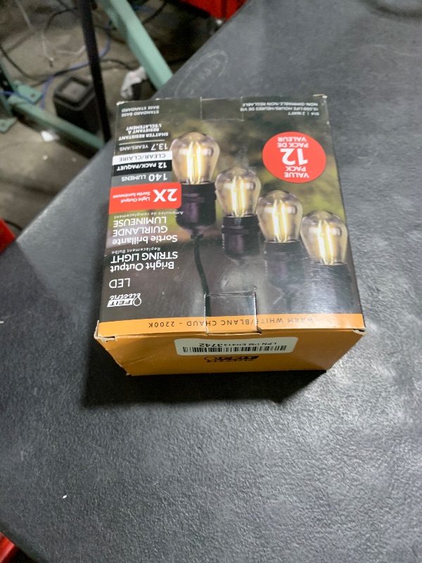 Photo 1 of Feit Electric S14 LED Filament Light Bulbs, High Output, 2200K Warm White, 140 Lumens, String Light Replacement Bulbs, 15,000-Hour Lifespan, Clear Durable Housing, S14HO/822/FIL/12, 12 Pack