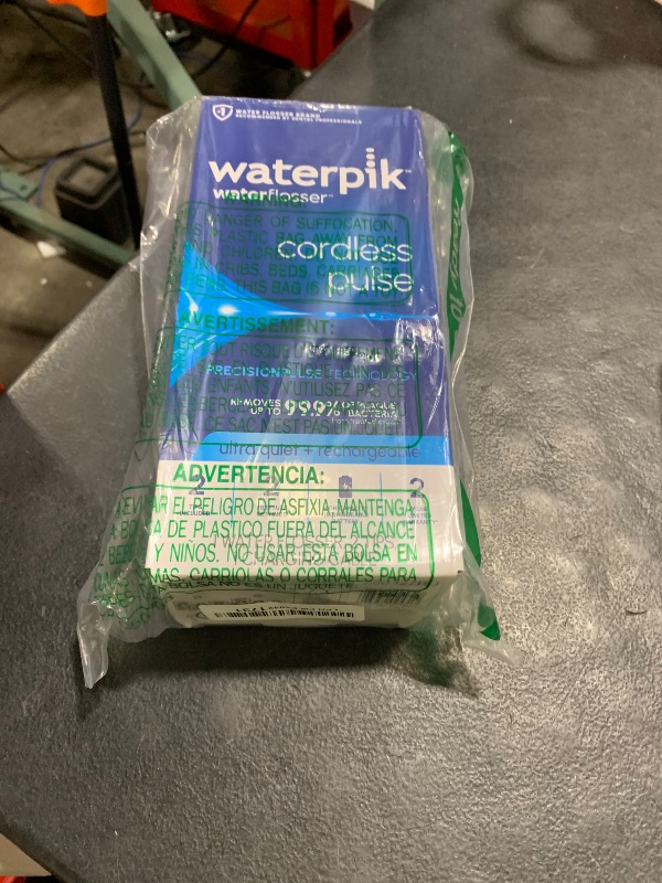 Photo 1 of Waterpik Cordless Pulse Rechargeable Portable Water Flosser for Teeth, Gums, Braces Care and Travel with 2 Flossing Tips, Waterproof, ADA Accepted, WF-20 White, Packaging May Vary