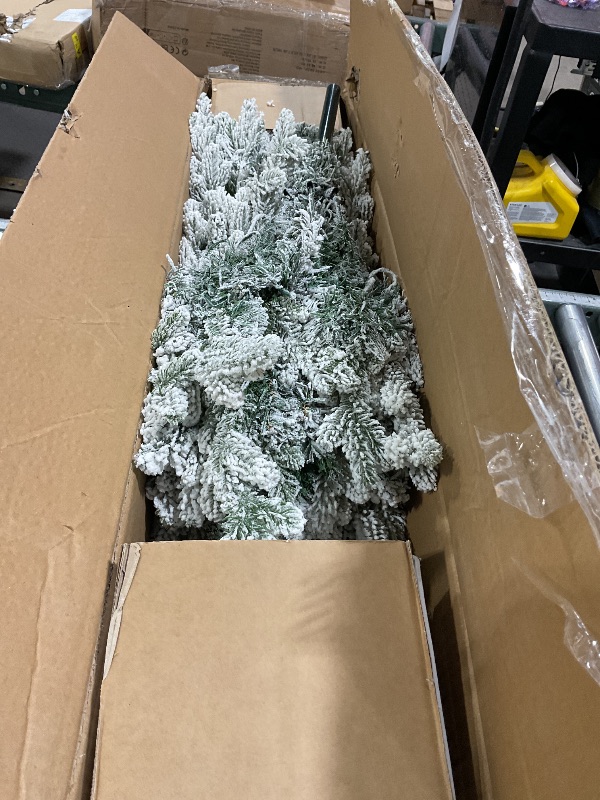 Photo 1 of **SMALLER IN PERSON*** DWVO 6 FT Slim Pre-lit Flocked Arctic Fir Pencil Tree, Potted Christmas Tree with 15 Red Berries, 520 PE & PVC Branch Tips, and 150 Lights for Home and Office Decor