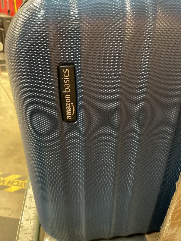 Photo 1 of ***UNKNOWN DMAAGES*** Amazon Basics 21" Hardside Carry-On Luggage, Hardshell Suitcase With Wheels, Expandable For Up to 25% More Space, With Scratch-Resistant Surface, Four Multi-directional Wheels, Navy Blue