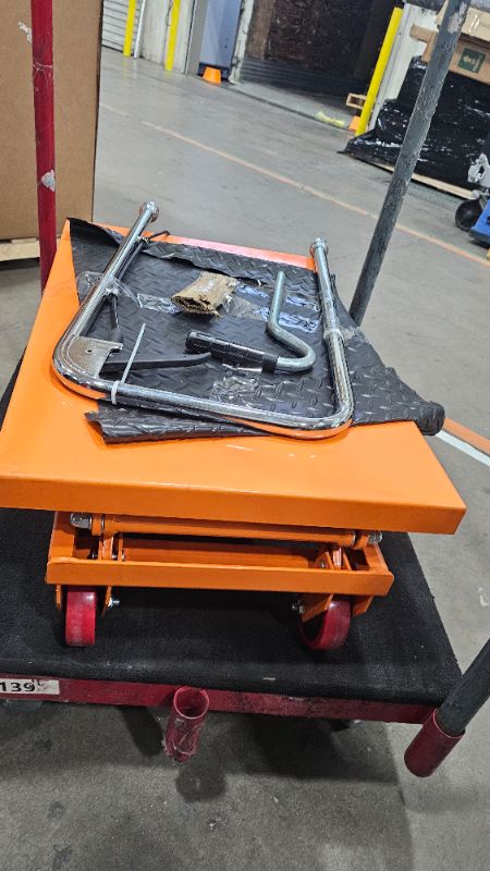 Photo 1 of ***PARTS ONLY***VEVOR Hydraulic Lift Table Cart, 330lbs Load Capacity 50 Inch Lifting Height, Manual Single Scissor Lift Table with Non-Slip Pad and 4 Wheels, Hydraulic Scissor Cart for Material Handling, Orange