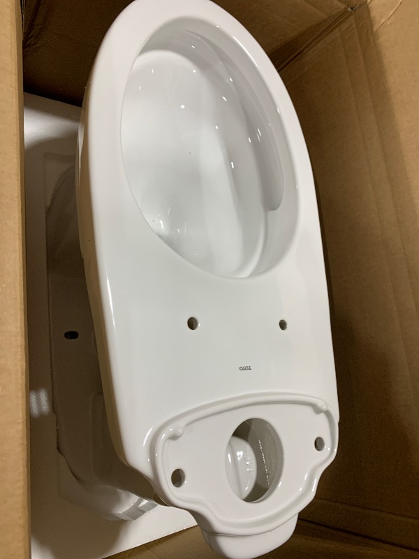 Photo 1 of TOTO Drake Transitional Two-Piece Elongated 1.28 GPF Universal Height TORNADO FLUSH Toilet with CEFIONTECT, Cotton White - CST786CEFG#01