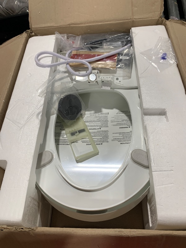Photo 1 of Coway Electronic Bidet Elongated Toilet Seat with Instantaneous Water Heating, Heated Seat and Dryer, Soft Close Lid, Stainless Nozzle, Self Cleaning, Remote Control 400S