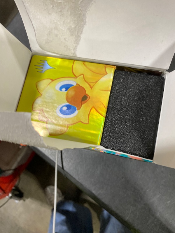 Photo 1 of Magic: The Gathering - Final Fantasy Chocobo Bundle (1 Chocobo Booster, 10 Play Boosters, 1 Alt-Art Promo Card, 1 Scene Card, 32 Basic Lands, 1 Click Wheel, and More)