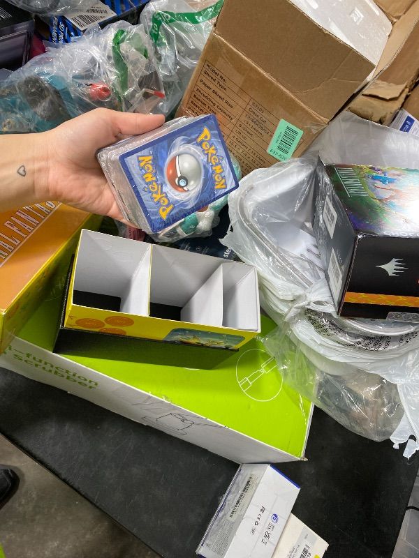 Photo 1 of Magic: The Gathering - Final Fantasy Chocobo Bundle (1 Chocobo Booster, 10 Play Boosters, 1 Alt-Art Promo Card, 1 Scene Card, 32 Basic Lands, 1 Click Wheel, and More)