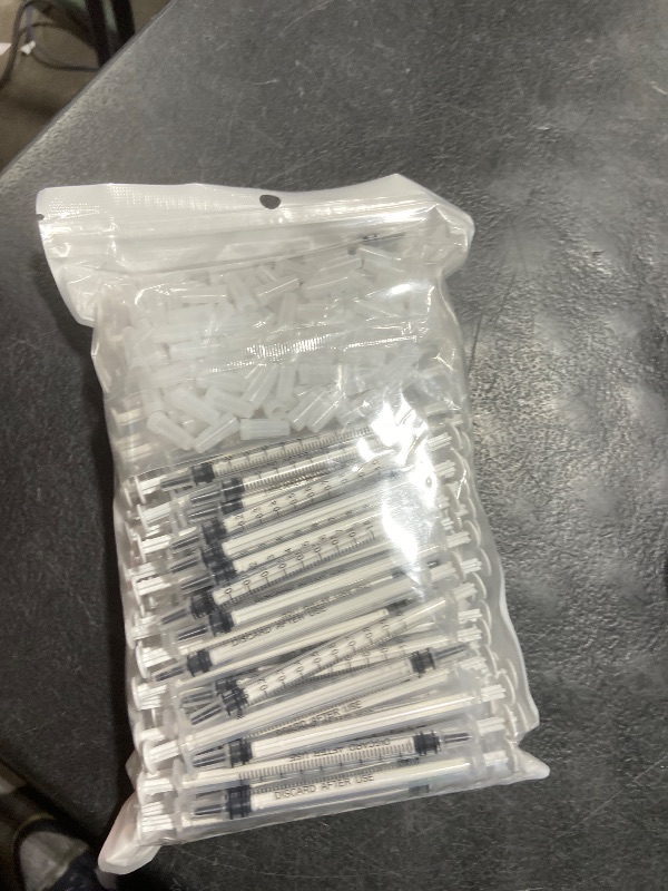 Photo 1 of 100 Pack 1ml Syringe with Cap for Liquid, 1cc Plastic Small Syringes with Cover, Non-Sterile, No Needle