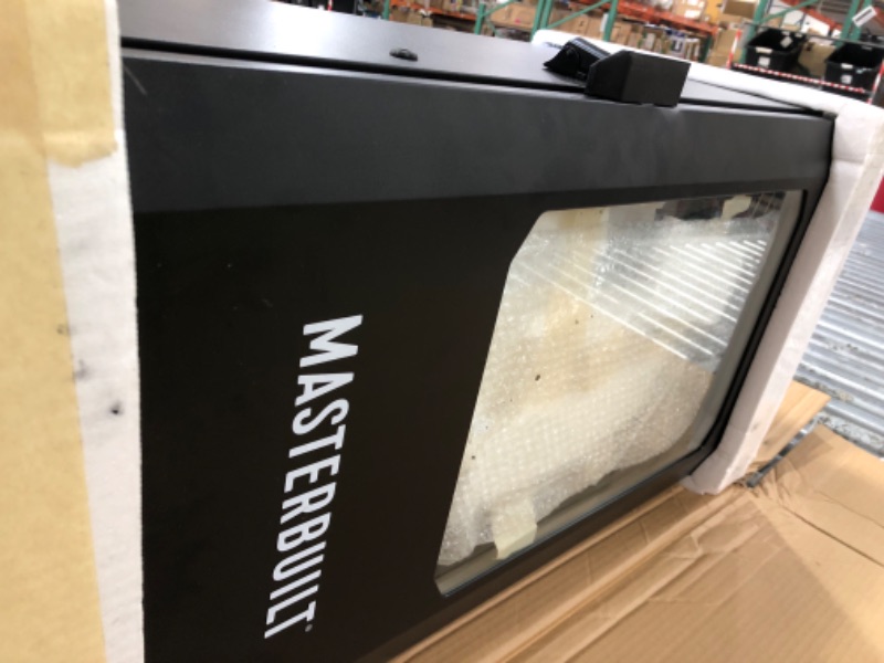 Photo 2 of Masterbuilt®710 WiFi Digital Smoker, Vertical Design, 711 Cooking Sq. Inches, 4 Chrome Coated Smoking Racks, Wood Chip Loader, Electric Fuel Source to Plug in and Start Cooking, Black Model MB20070924