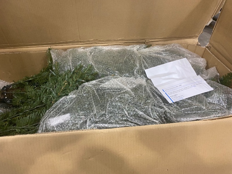 Photo 1 of Puleo International 12ft Pre-Lit Slim Fraser Fir Christmas Tree with 1200 Clear Lights, 3903 Realistic Dense Branch Tips, Easy Setup Artificial Trees with Sturdy Metal Stand