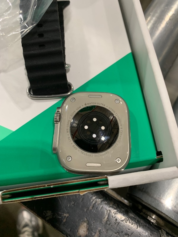 Photo 1 of Apple Watch Ultra [GPS + Cellular 49mm] Titanium Case with Midnight Ocean Band, One Size (Renewed Premium)