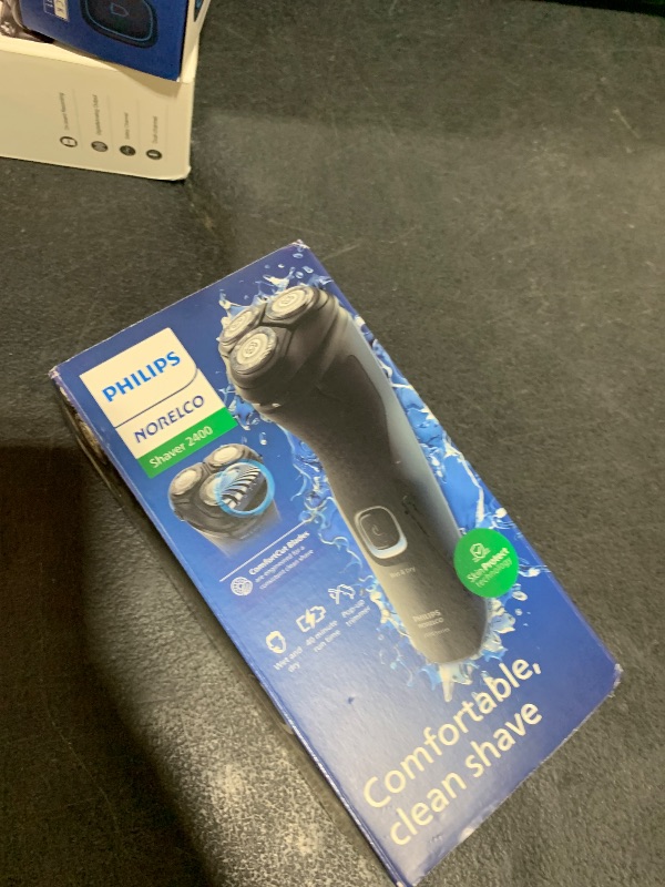 Photo 1 of Philips Norelco Shaver 2400 Series, Wet and Dry Electric Shaver, Pop-up Trimmer, P-Cap, Deep Black, Model X3001/90